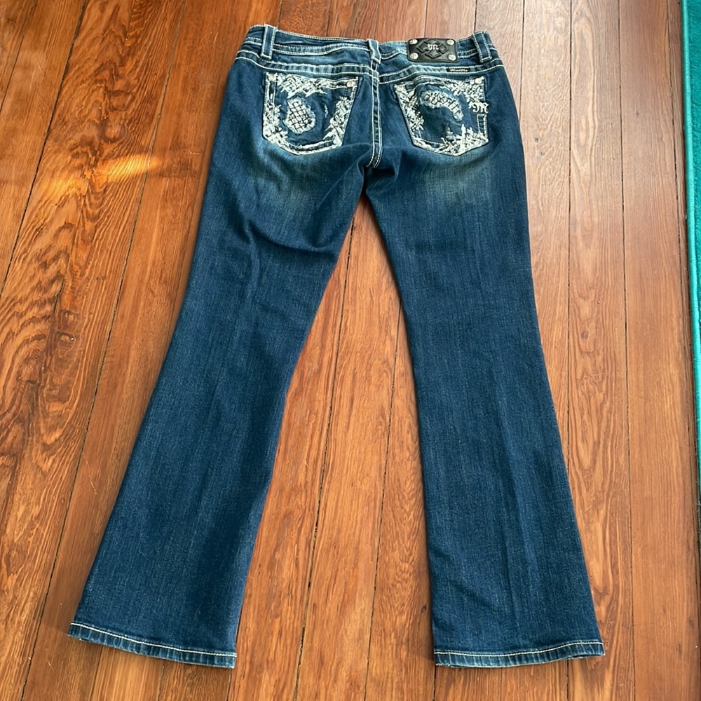 Miss Me gently worn boot cut jeans.